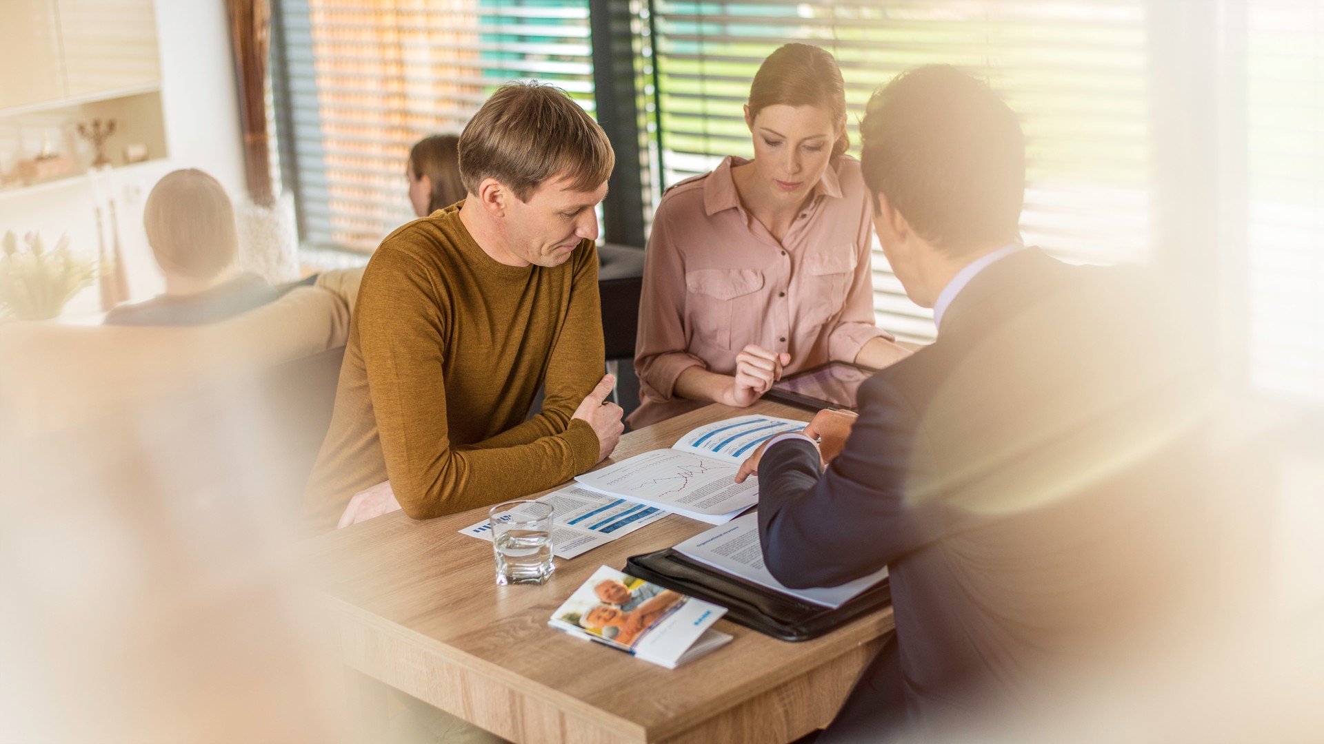 Finance advisor talking to a couple about finance plan